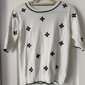 Amazon White Knit Top with Black Flower Trim